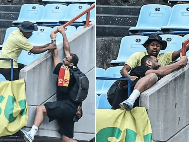 نجات هوادار از مرگ به دست تماشاچی رقیب!